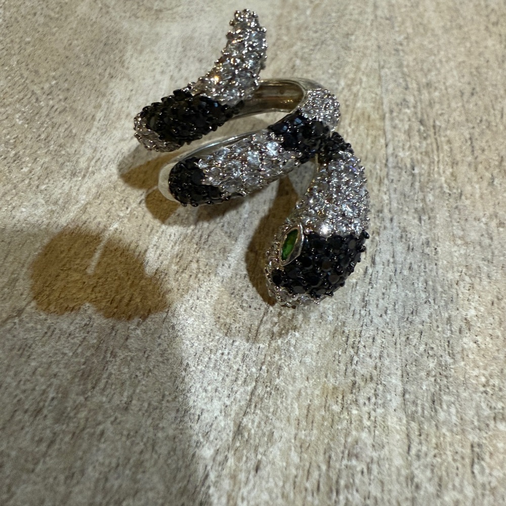 Glamorous Black and Silver Snake Ring with Green Accents